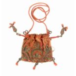A 17th Century salmon pink silk purse embroidered in silver wire thread, the drawstring cord
