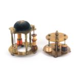 Two 19th Century brass reel stands, comprising a single tier example raised on four knurled feet