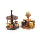 Two small 19th Century wooden reel stands, comprising a turned sycamore example, the base in