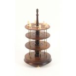 An early 19th Century mahogany reel stand, raised on three bone feet, of four circular tiers with