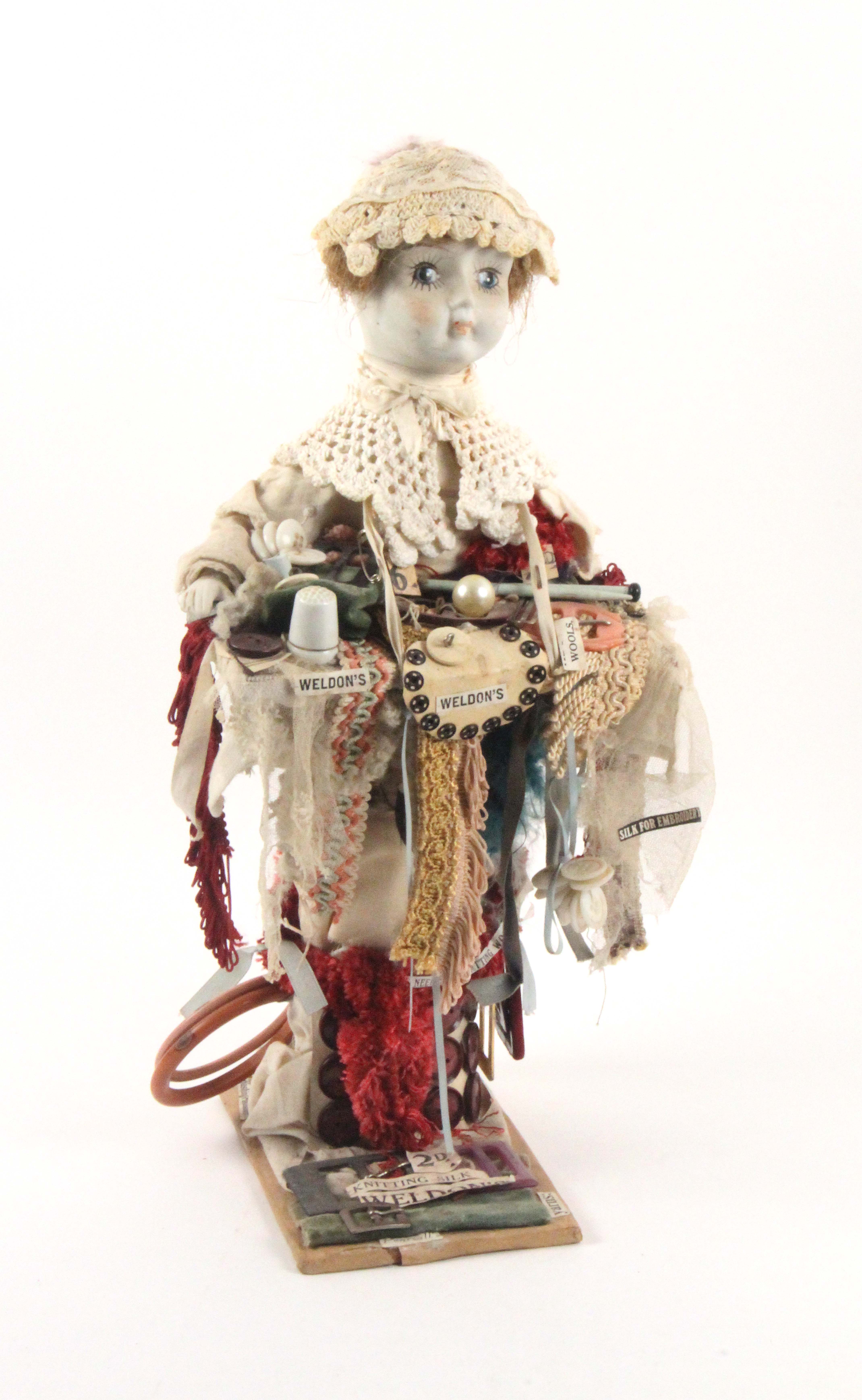 A ceramic headed doll for a shop window, in the form of a pedlar doll with tray of vintage 1930's