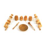 Nine white wood sewing accessories and tools, comprising a pair of winding clamps with bowl tops,