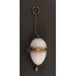 A French finger ring etui for a child or doll, the frosted glass egg with gilt metal mounts to a