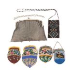 Five beadwork purses and a chain mail bag, comprising four 19th Century beadwork purses, three