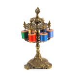 An elaborate mid 19th Century cast brass reel stand, the leaf scroll base to a baluster pedestal