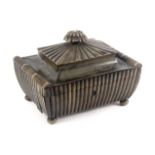 An Anglo-Indian horn sewing box, circa 1820, of reeded sarcophagal form raised on bun feet, the