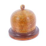 An early painted Tunbridge ware bee skep pin poppet, of large size, the rope simulated body with