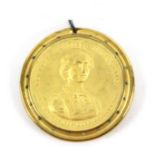 A rare commemorative gilt metal pin wheel, one side with bust portrait and inscribed 'His Royal