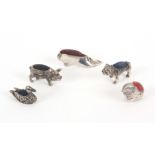 Five 20th Century white metal pin cushions, comprising a pig, 4cms, a bulldog, 3.4cms, a duck, 3.