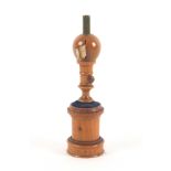 A French beech wood etui inscribed Fontainbleau, perhaps modelled on a fountain, the cylinder form