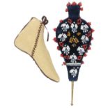 A pin cushion and a needle case, the first in the form of a shoe in ivory silk with brown infill,