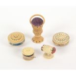 Five bone and vegetable ivory pin cushions, comprising two disc form examples, each 4cms dia.,