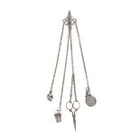 A Victorian steel chatelaine, the clip with pierced scallop mount to four chains, the fittings