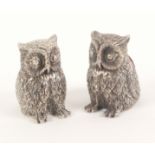 A pair of white metal owl form pin cushions, 20th Century, one with red velvet back pad the other