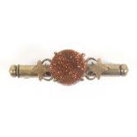 A Nanny brooch, circular spangle within leaf and scroll mounts, the cylinder stamped 'DRGM