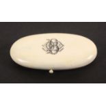 A late 19th Century French oval ivory etui, the lid monogramed BM?, the flush fitted interior with