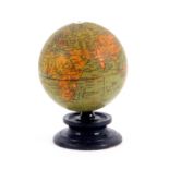 A rare 'Clark and Cos. Anchor Sewing Cottons' world globe thread ball, rotating on an ebonised