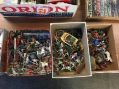 Three boxes of loose painted figures and accessories