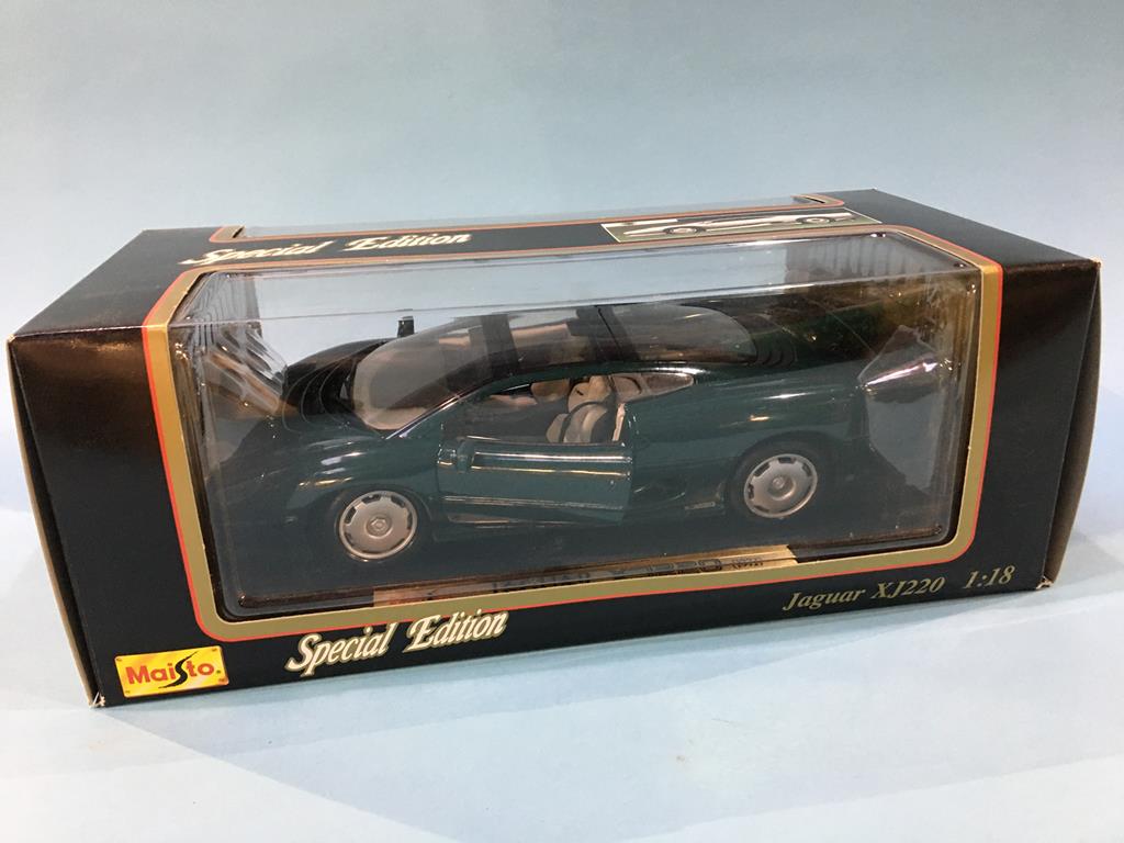 A boxed Maisto Jaguar XJ220 Die Cast model, three 1:18 scale Maisto Die Cast cars, boxed and a 1: - Image 7 of 7