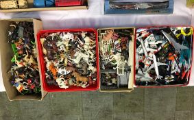 Four boxes of loose Britains Limited toy farmyard animals, Napoleonic cavalry, aircraft and
