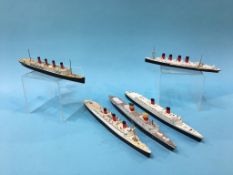 A Triang Minic RMS Queen Elizabeth, a Mercator model of the Queen Mary and three other Die Cast