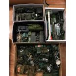 Quantity of loose Die Cast military vehicles etc., in four boxes