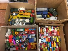 Four boxes of Die Cast cars and vehicles