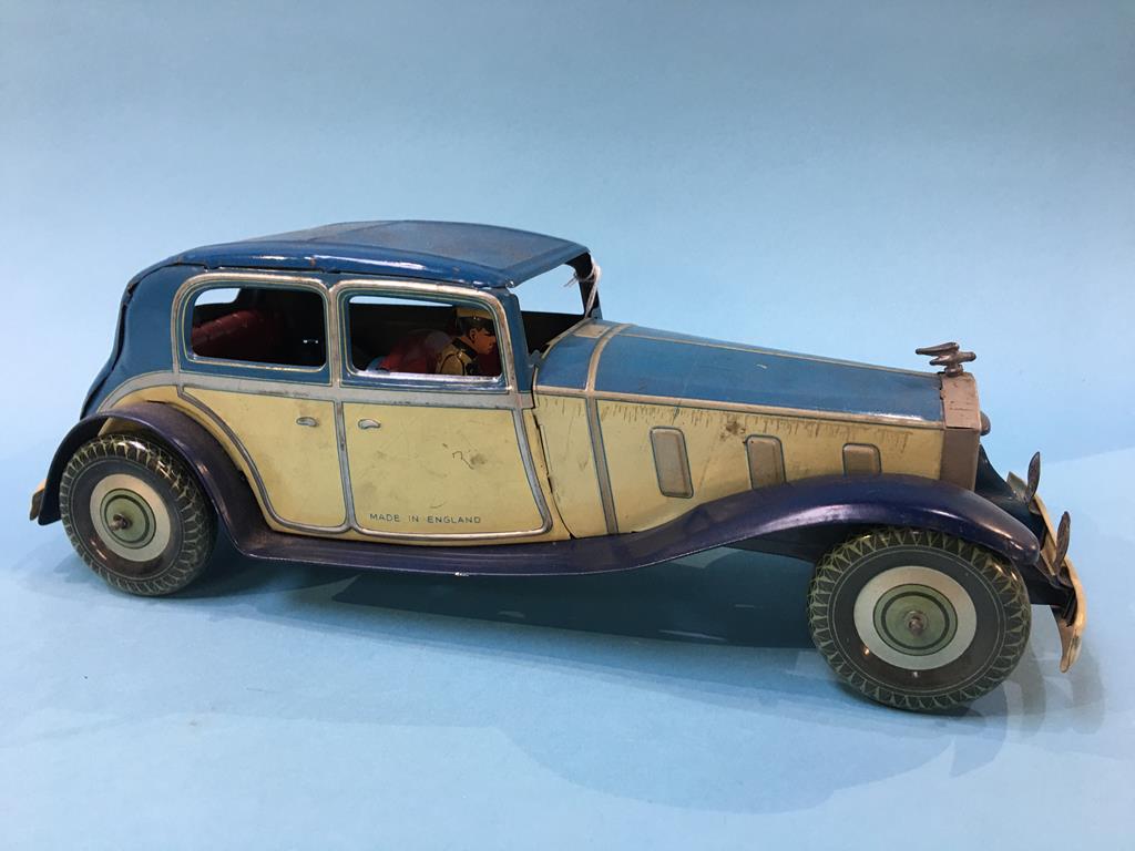 A clockwork tin plate model of a Rolls Royce, complete with chauffer, 'Made in England', 36 cm long - Image 2 of 4