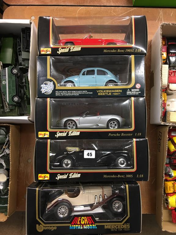 Five boxed Die Cast cars Maisto, Burago and Road Tough