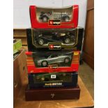 Four boxed Die Cast cars, Burago and Revell and a Limited Edition presentation case of Matchbox