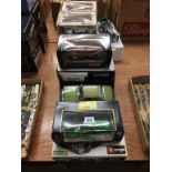 A quantity of individually boxed Burago and Maisto Die Cast cars (9)