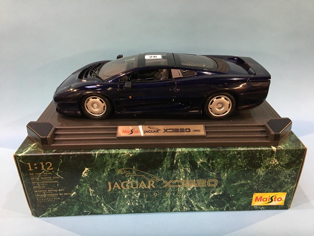 A boxed Maisto Jaguar XJ220 Die Cast model, three 1:18 scale Maisto Die Cast cars, boxed and a 1: - Image 2 of 7