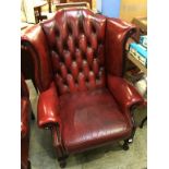 An oxblood Chesterfield high back armchair