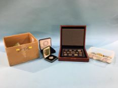 A boxed presentation 2003 silver proof crown , a boxed 2003 DNA 2 pound coin, a Falkland Island 50