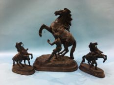 A Spelter Marley horse and a pair of smaller horses