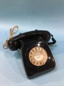 A black 1970s style telephone