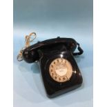 A black 1970s style telephone