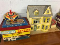 A dolls house, six vintage board games to include M-Squad, Four Just Men, High Patrol and a spinning