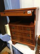 A Yew wood bedside chest, with brushing slide