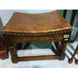 An oak leather top stool