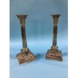 A pair of silver Corinthian column candlesticks, supported on stepped bases, Sheffield, 1897,