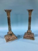 A pair of silver Corinthian column candlesticks, supported on stepped bases, Sheffield, 1897,