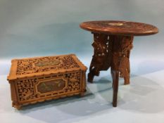 A walnut pierced casket, decorated with applied enamelled butterflies, 30 x 19cm and a small folding