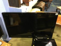 Sony wall mounted TV, 32", with remote