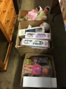 Three boxes of boxed and unboxed dolls and a teddy bear