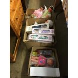 Three boxes of boxed and unboxed dolls and a teddy bear