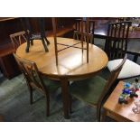 A G Plan teak table, four chairs and cabinet