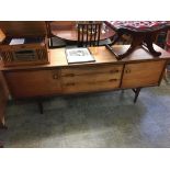 A long teak sideboard