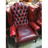 An oxblood Chesterfield high back armchair