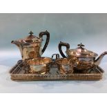 A silver plated tray and a four piece tea service
